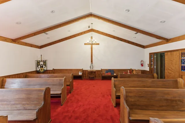 a house view with pool and sitting area