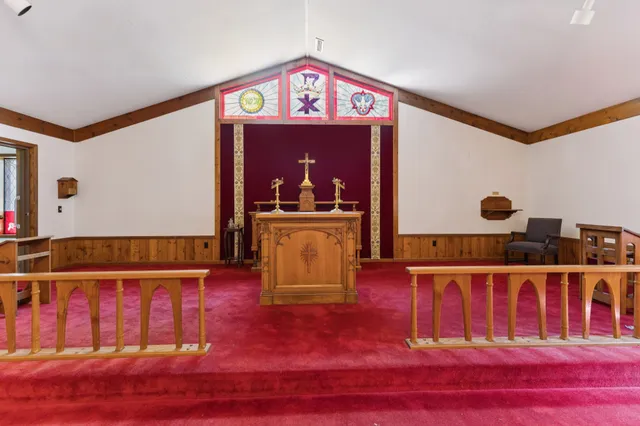 a bedroom with furniture and a wooden floor