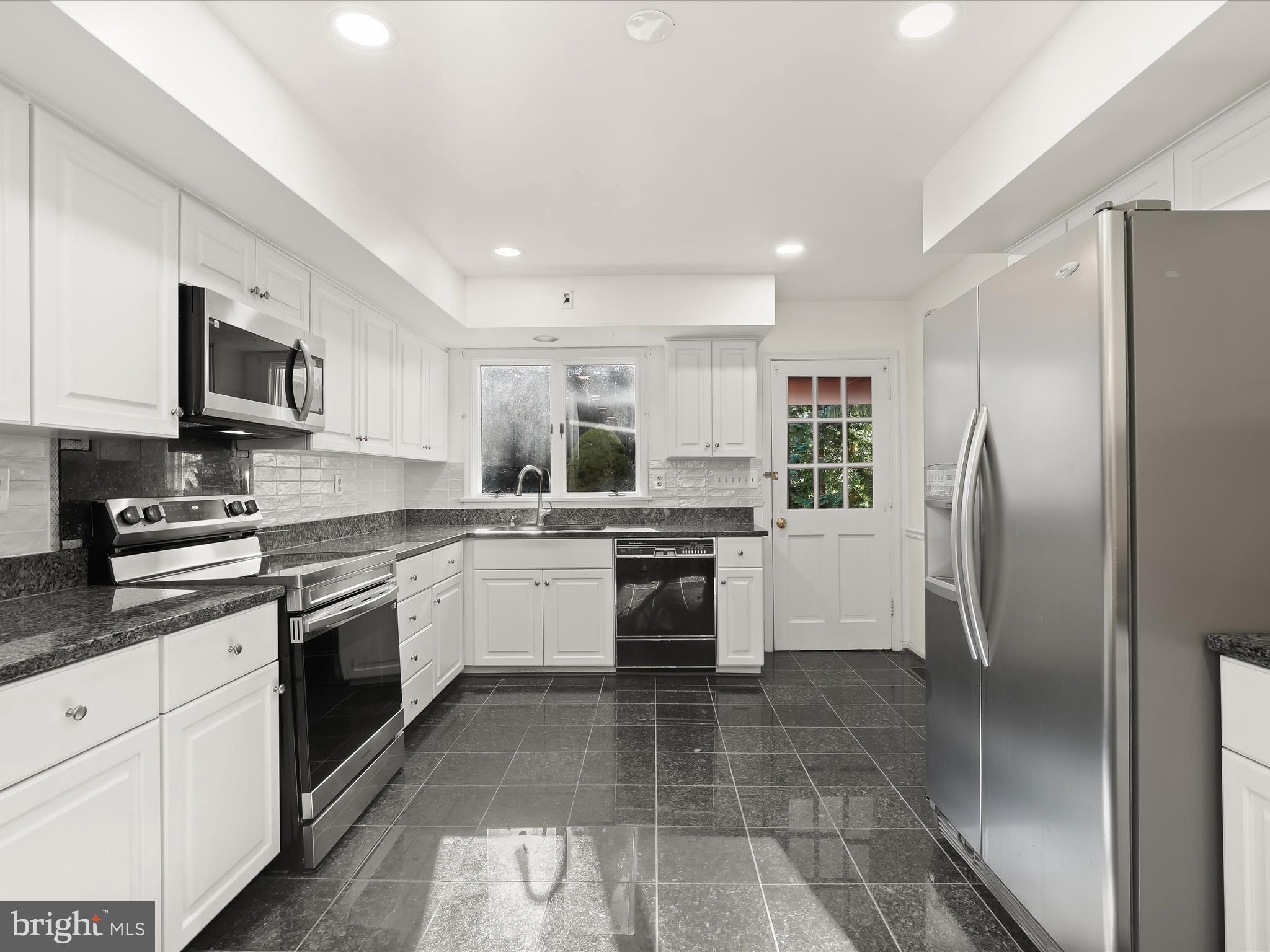 13719 Killarney Court Phoenix, MD 21131 - Photo 19 of 81 a kitchen with a refrigerator a sink and cabinets