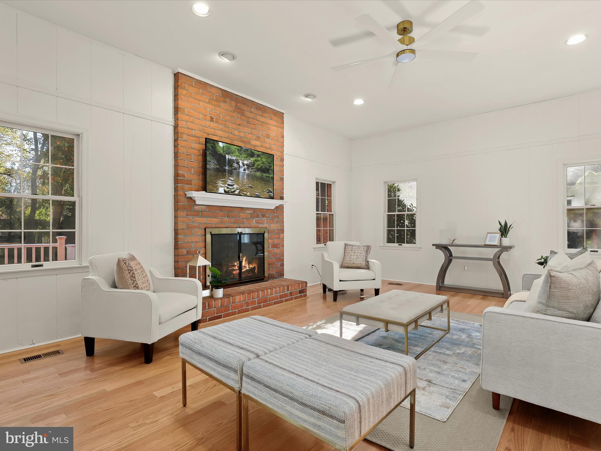 13719 Killarney Court Phoenix, MD 21131 - Photo 22 of 81 a living room with furniture a fireplace and a table