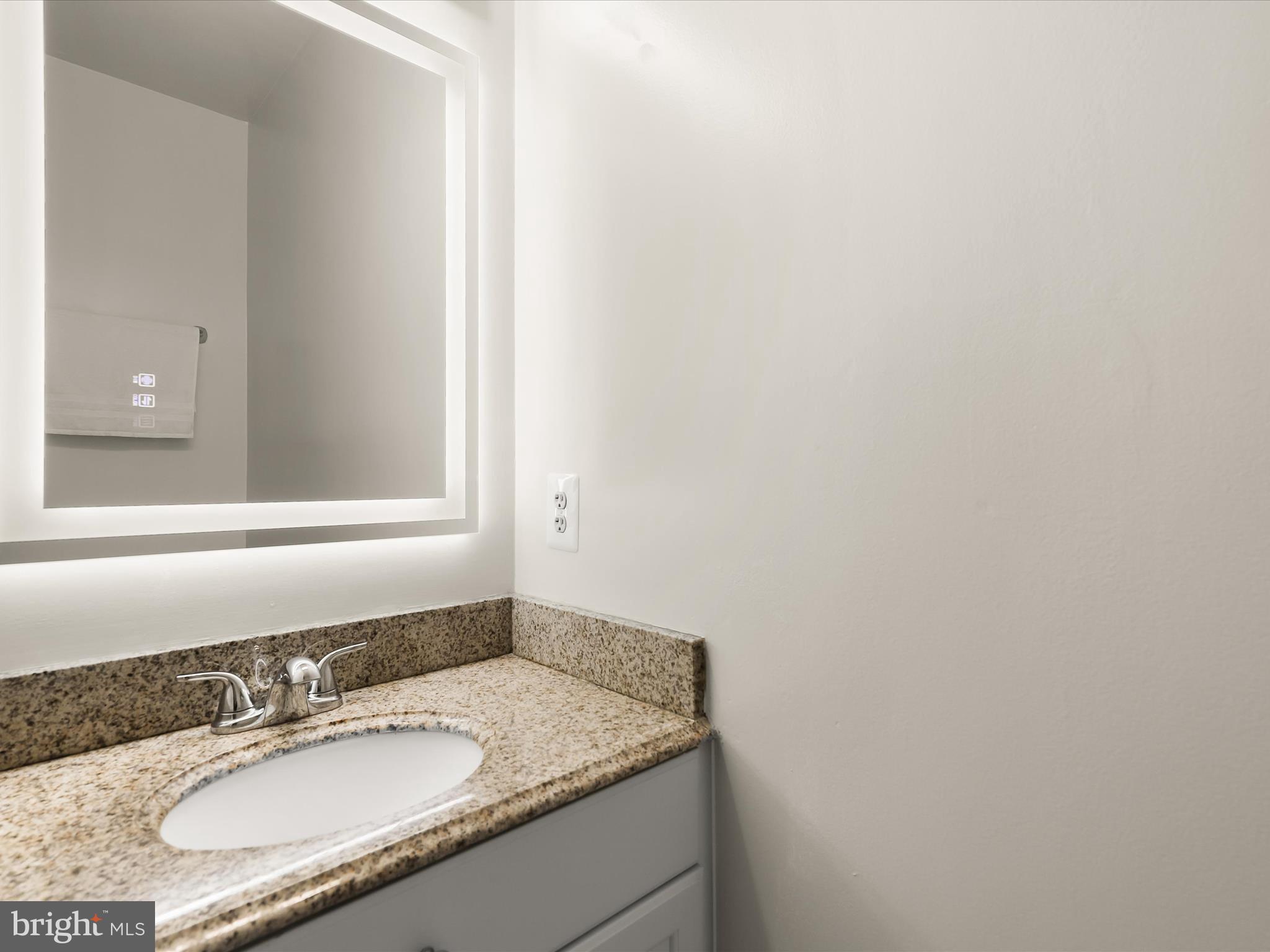 13719 Killarney Court Phoenix, MD 21131 - Photo 29 of 81 a bathroom with a granite countertop sink and a mirror