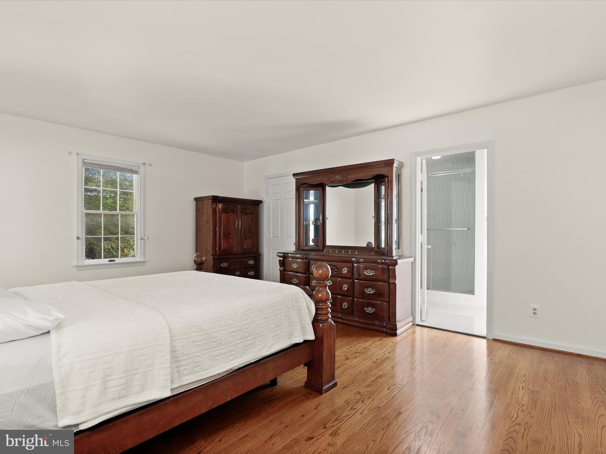 13719 Killarney Court Phoenix, MD 21131 - Photo 31 of 81 a bedroom with a large bed and a dresser