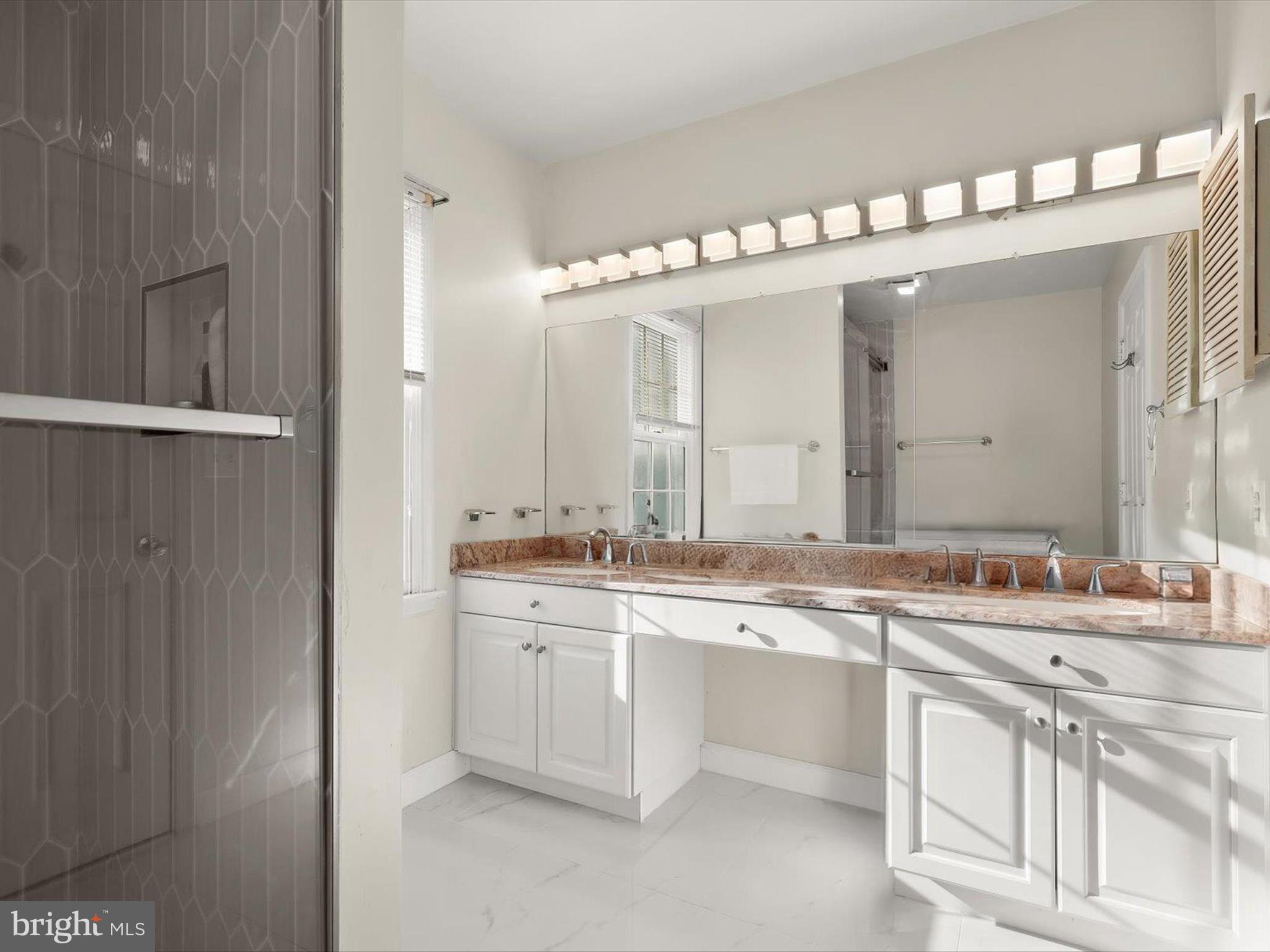 13719 Killarney Court Phoenix, MD 21131 - Photo 32 of 81 a large bathroom with a sink and a mirror