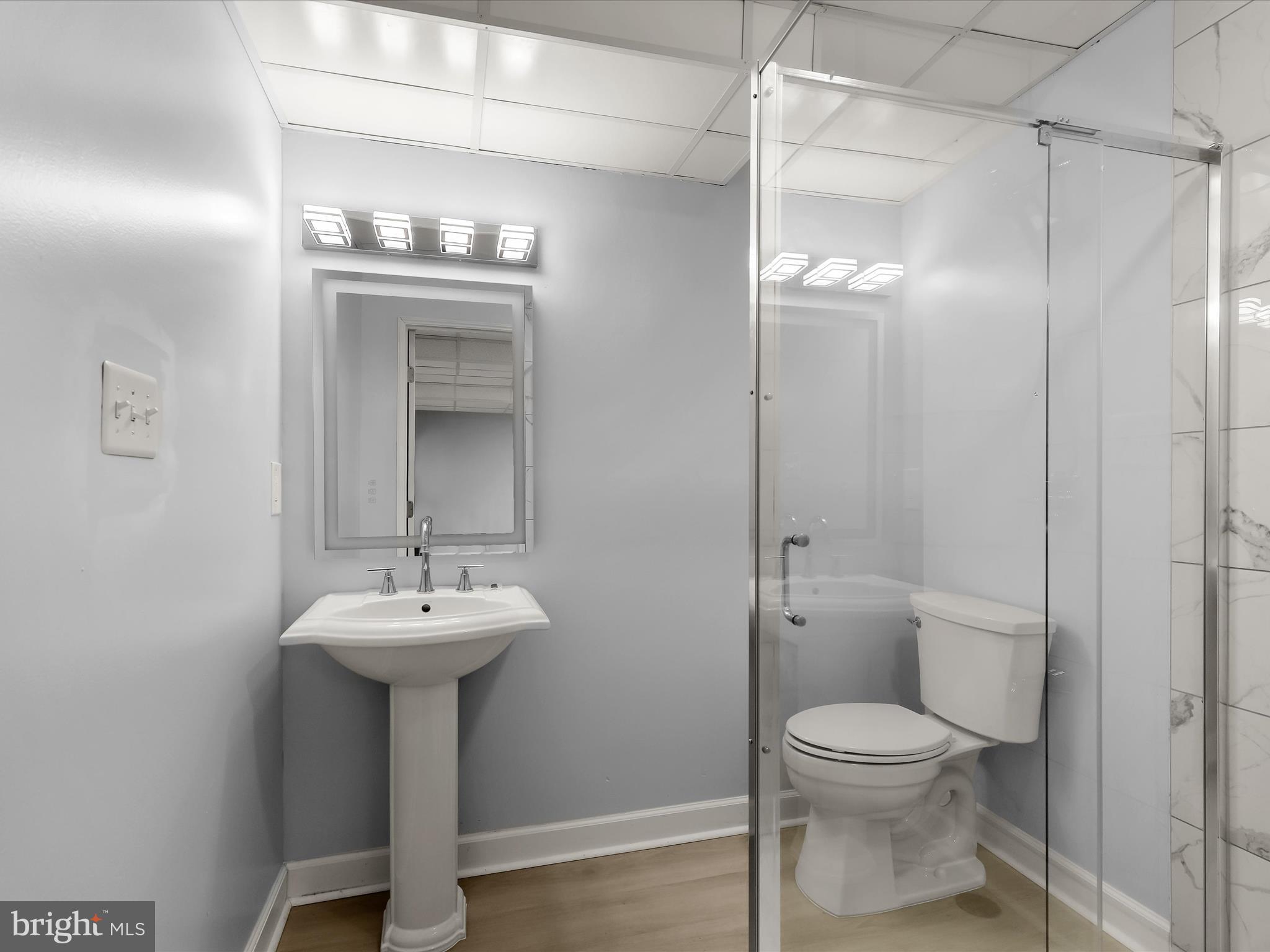 13719 Killarney Court Phoenix, MD 21131 - Photo 52 of 81 a bathroom with a sink a mirror toilet and shower