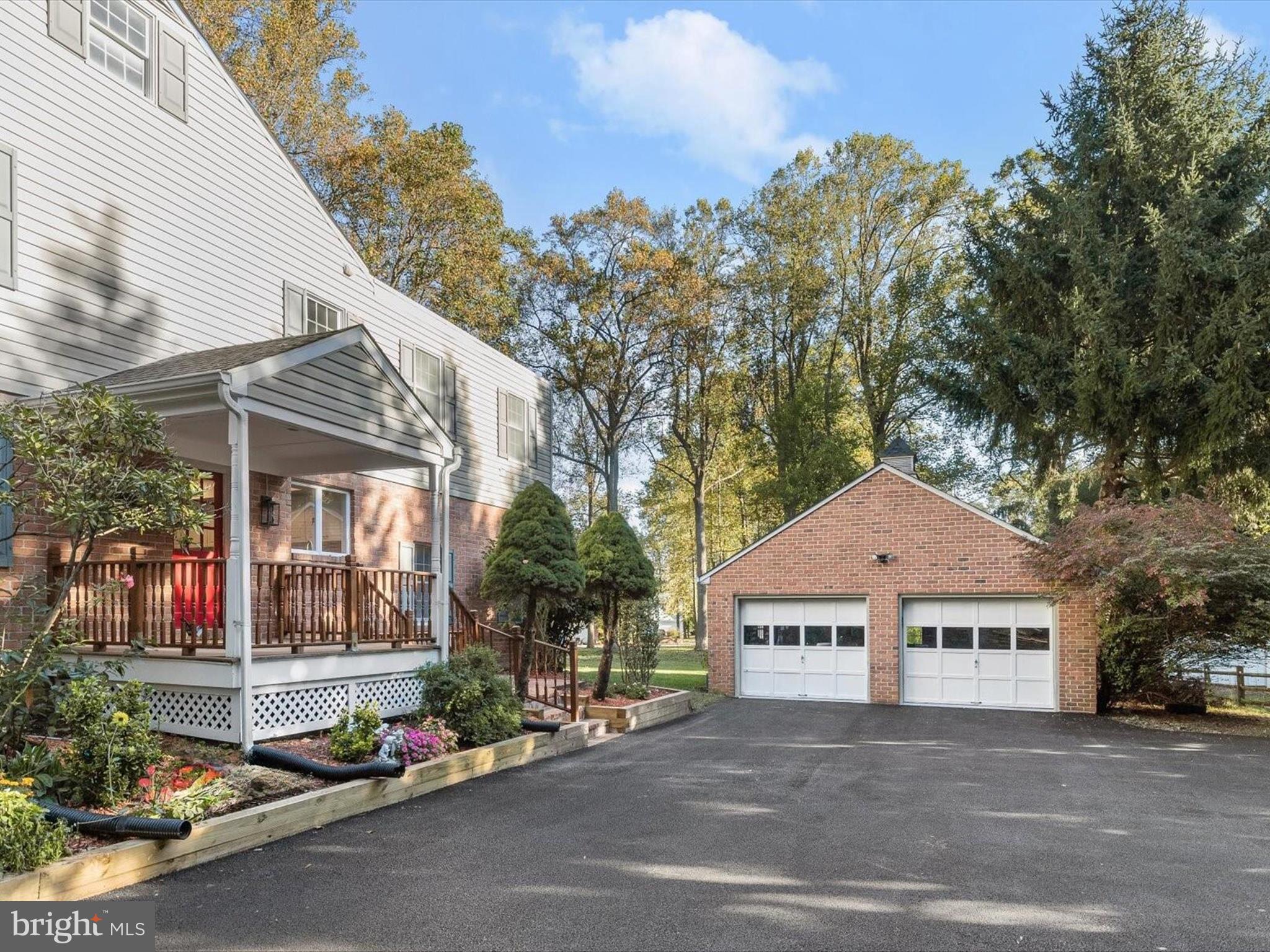13719 Killarney Court Phoenix, MD 21131 - Photo 56 of 81 a front view of a house with a yard and garage