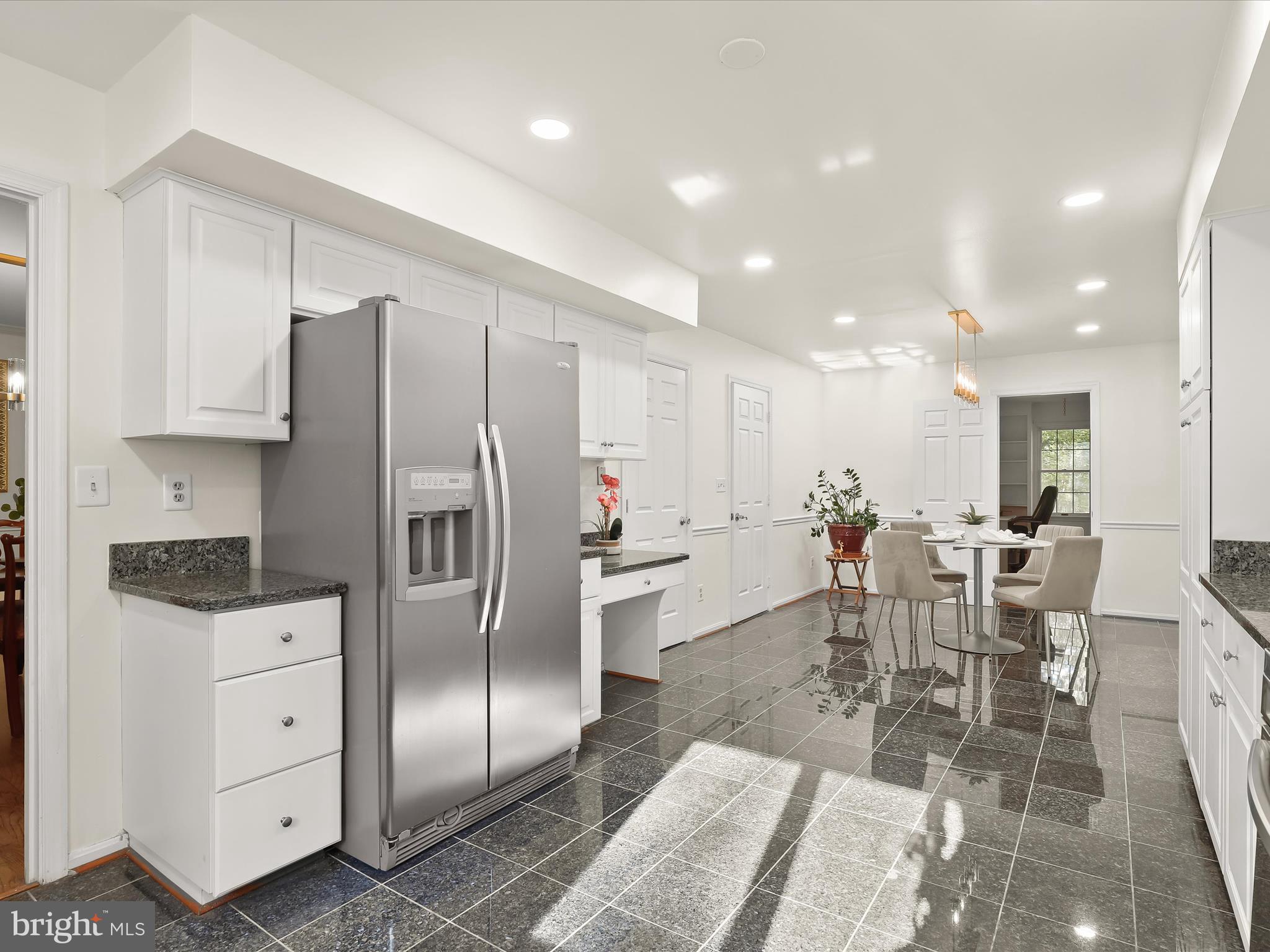 13719 Killarney Court Phoenix, MD 21131 - Photo 6 of 81 a kitchen with white cabinets and stainless steel appliances