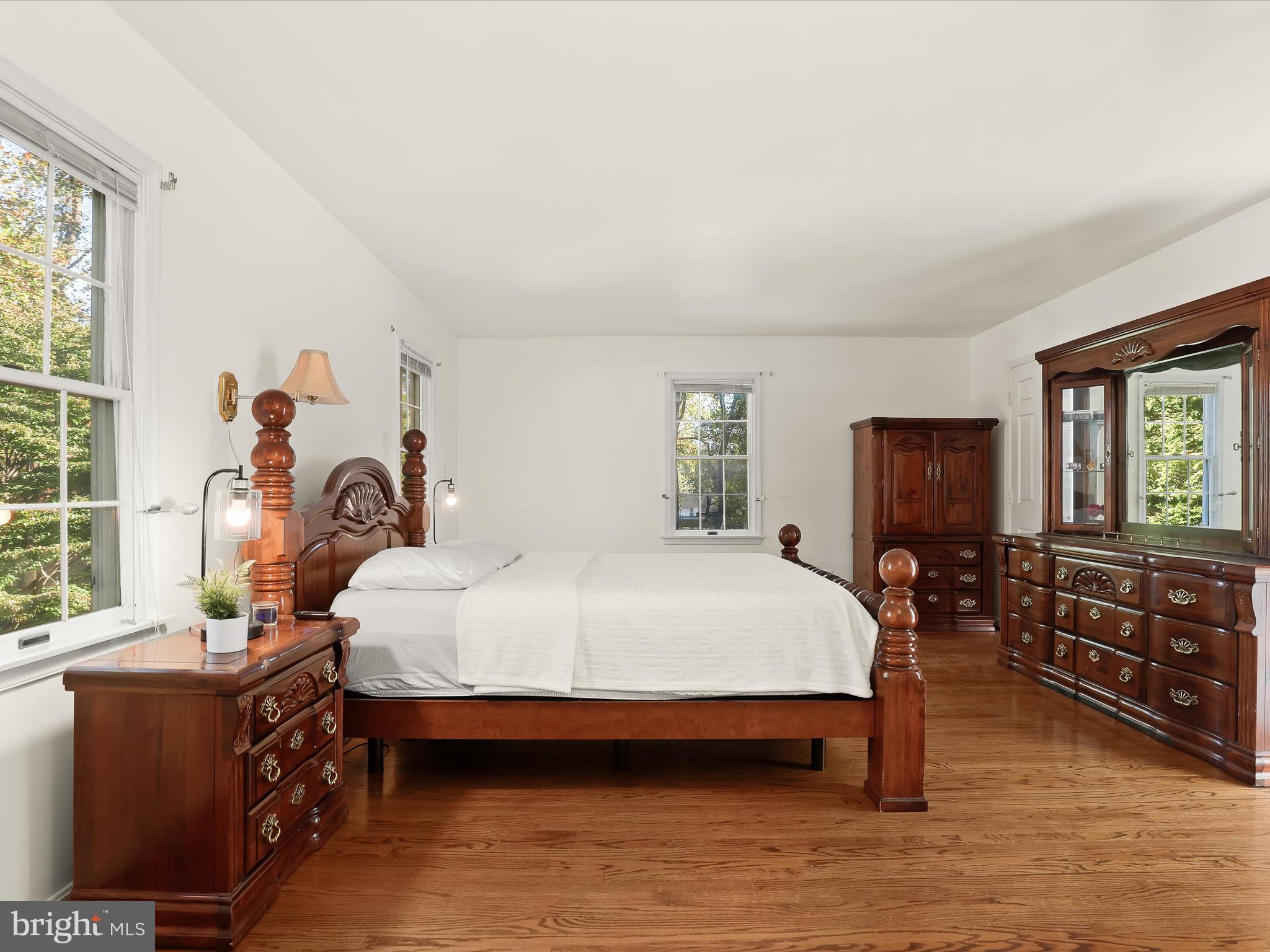 13719 Killarney Court Phoenix, MD 21131 - Photo 7 of 81 a bedroom with a bed and wooden floor