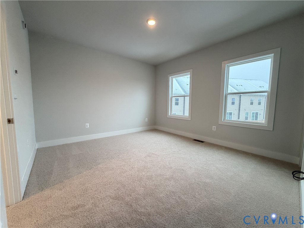 9450 Belladdie Way Glen Allen, VA 23059 - Photo 13 of 23 an empty room with windows