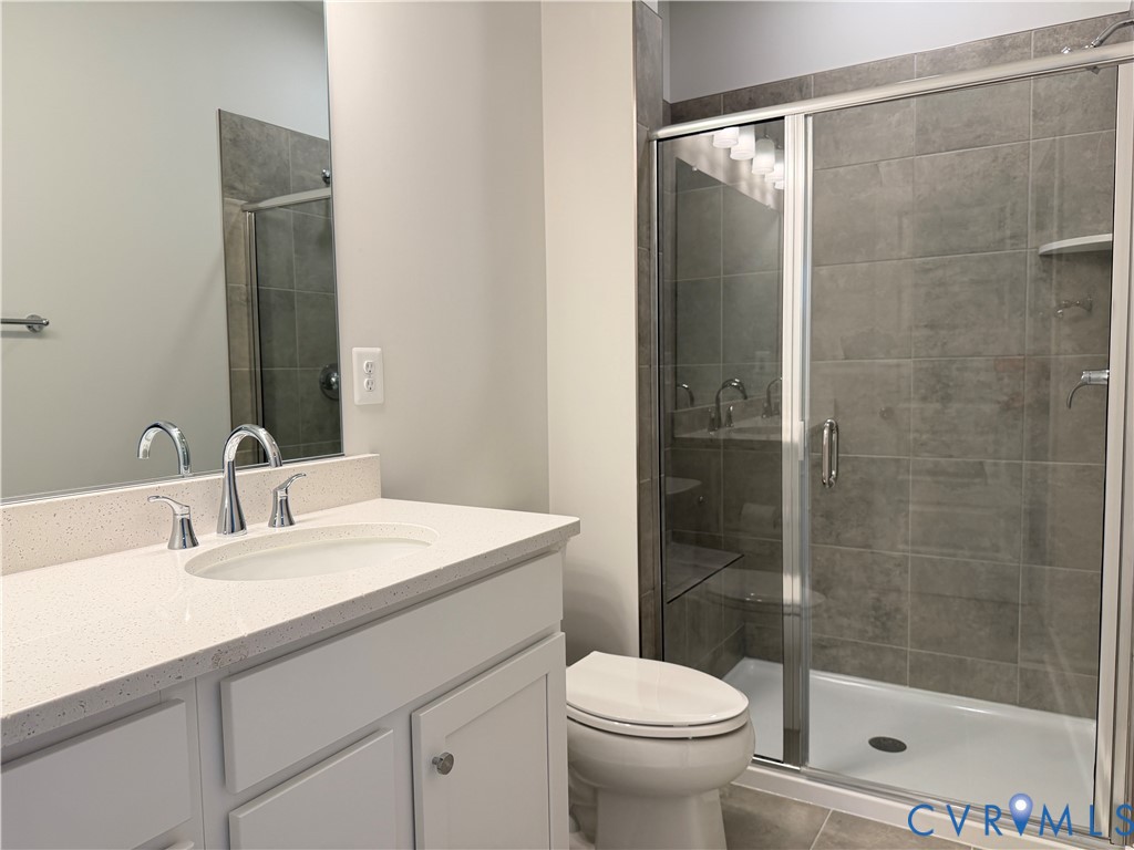 9450 Belladdie Way Glen Allen, VA 23059 - Photo 14 of 23 a bathroom with a sink and a mirror