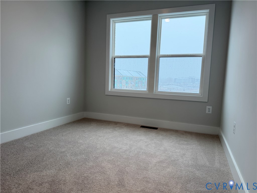9450 Belladdie Way Glen Allen, VA 23059 - Photo 17 of 23 an empty room with a window