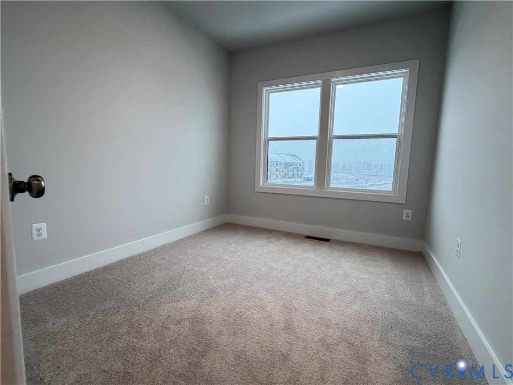 9450 Belladdie Way Glen Allen, VA 23059 - Photo 18 of 23 an empty room with a window