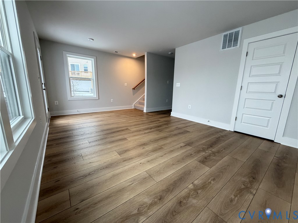 9450 Belladdie Way Glen Allen, VA 23059 - Photo 20 of 23 an empty room with wooden floor and windows