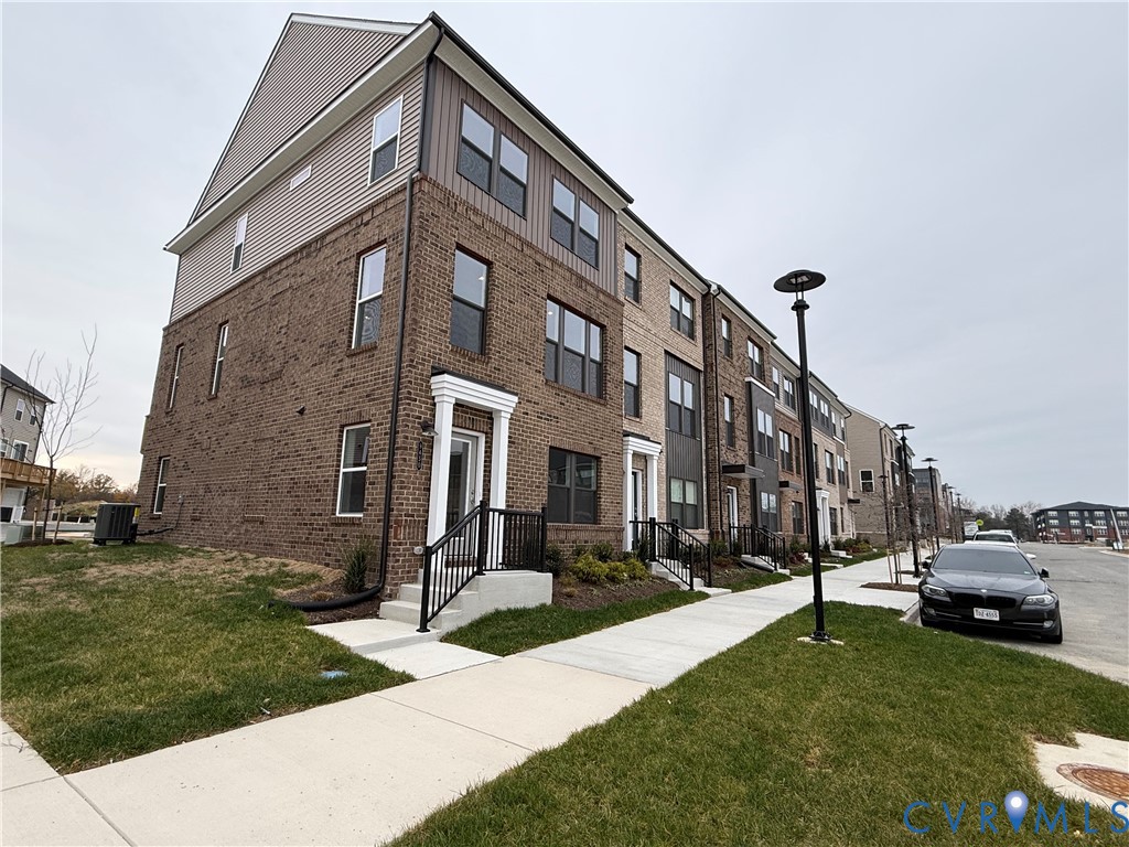 9450 Belladdie Way Glen Allen, VA 23059 - Photo 2 of 23 a view of a building with a yard
