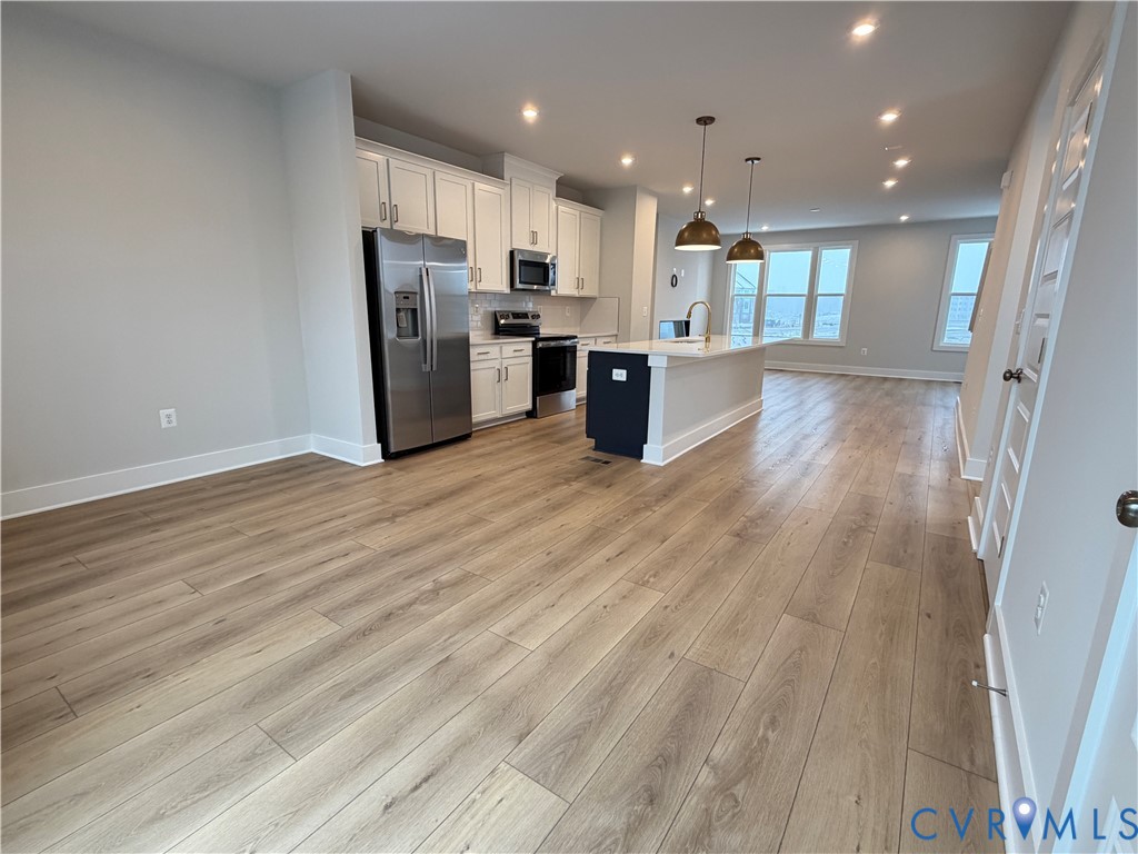 9450 Belladdie Way Glen Allen, VA 23059 - Photo 5 of 23 a view of kitchen view wooden cabinets and stainless steel appliances