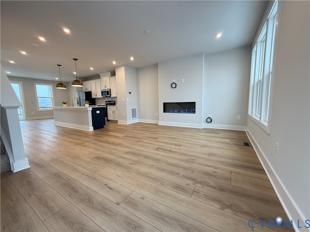 9450 Belladdie Way Glen Allen, VA 23059 - Photo 7 of 23 a view of kitchen with furniture and wooden floor