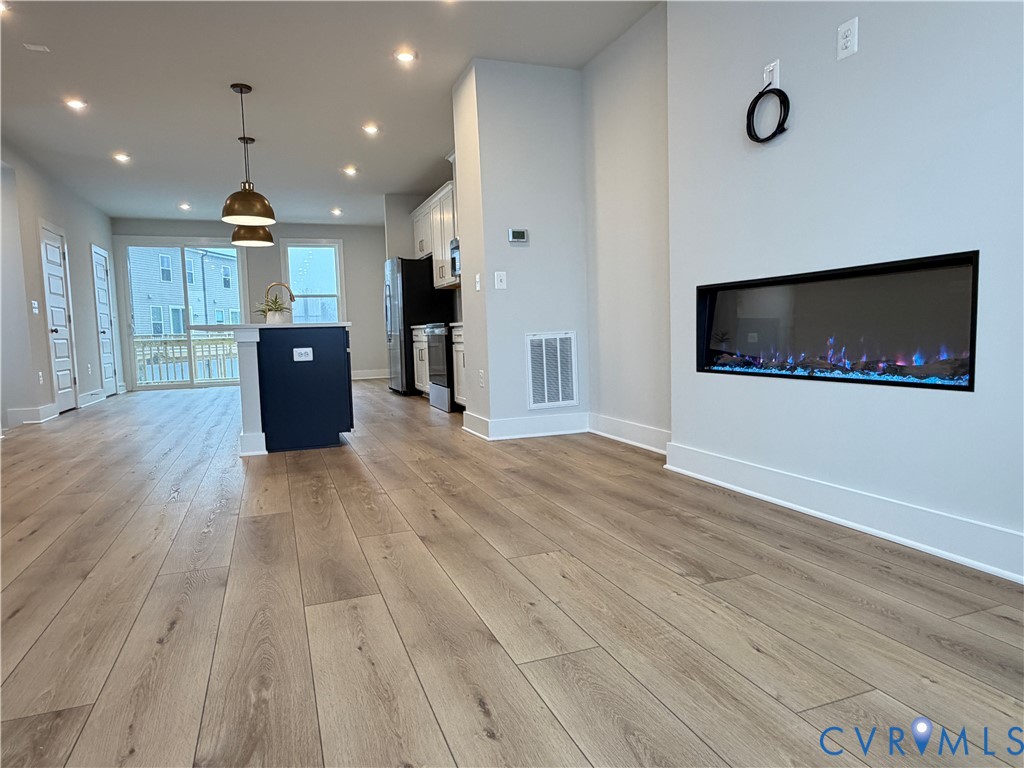 9450 Belladdie Way Glen Allen, VA 23059 - Photo 8 of 23 a view of kitchen with furniture and wooden floor