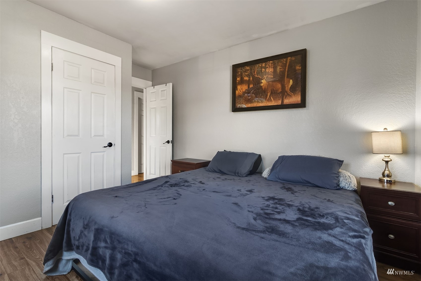 7236 South Montgomery Street Tacoma, WA 98409 - Photo 16 of 34 a bedroom with a bed and a painting on the wall