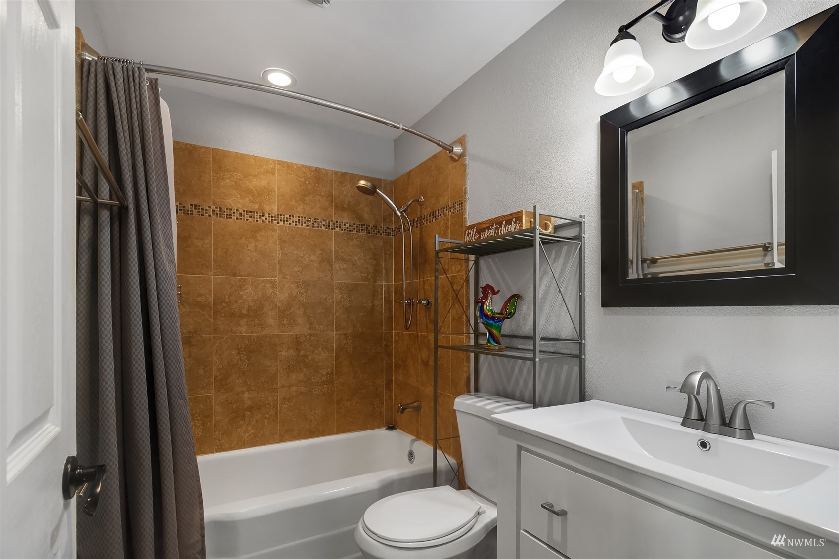 7236 South Montgomery Street Tacoma, WA 98409 - Photo 17 of 34 a bathroom with a sink toilet and shower