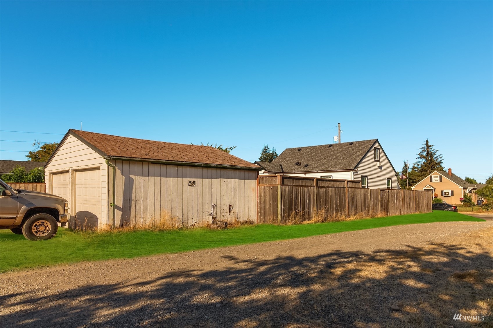 7236 South Montgomery Street Tacoma, WA 98409 - Photo 28 of 34 a front view of a house with a yard and garage