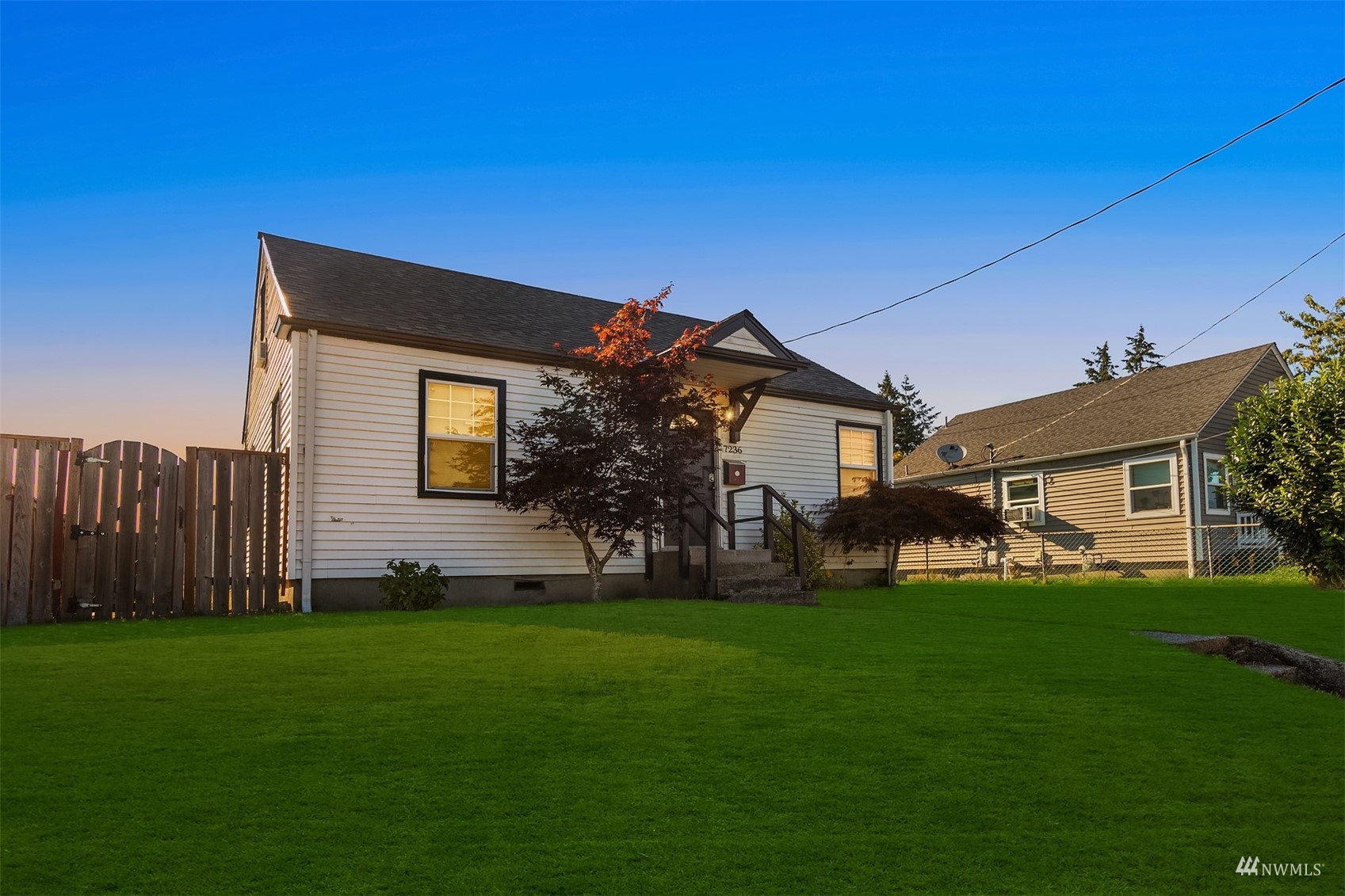 7236 South Montgomery Street Tacoma, WA 98409 - Photo 5 of 34 a front view of house with a garden and patio