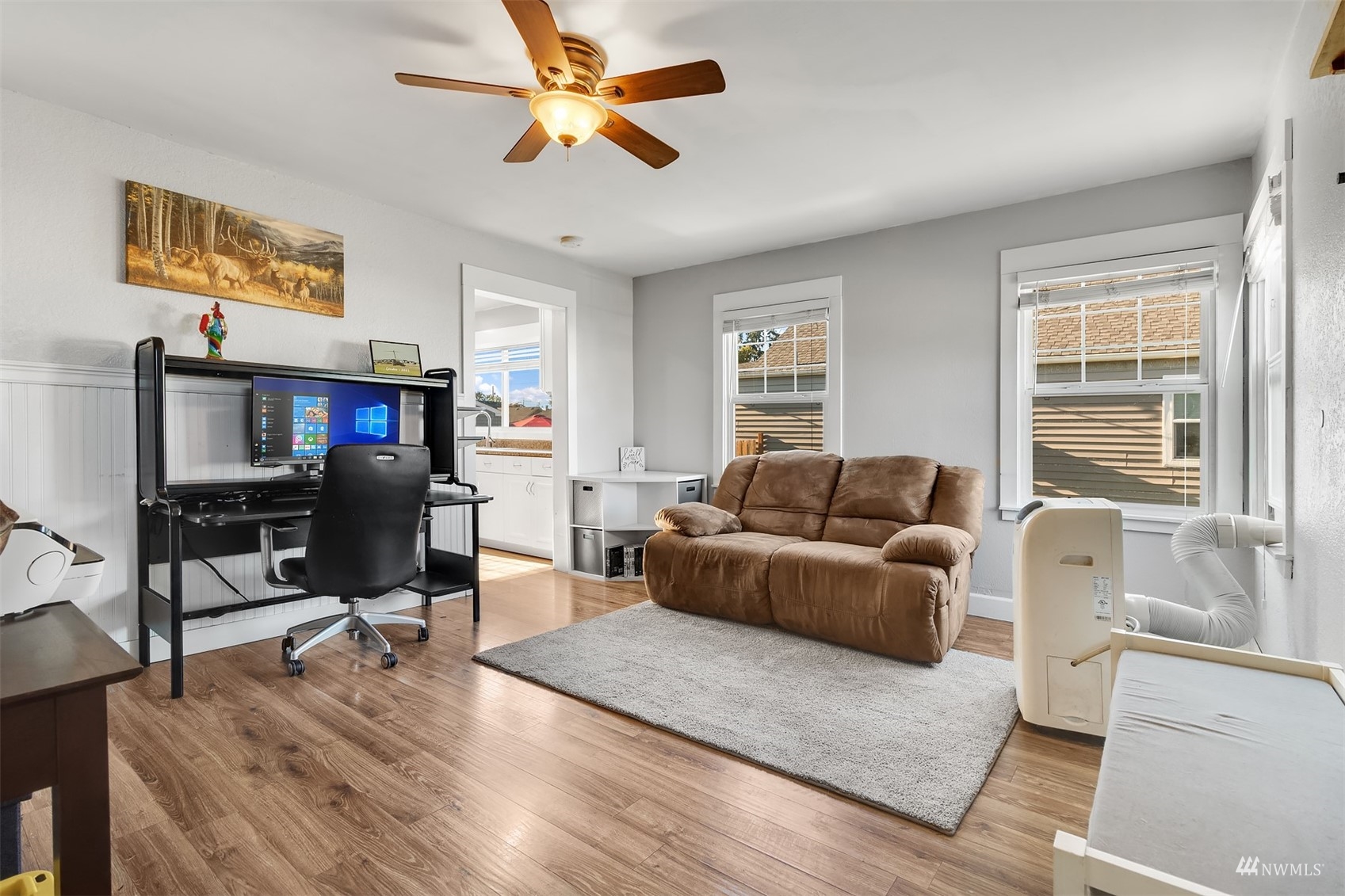 7236 South Montgomery Street Tacoma, WA 98409 - Photo 6 of 34 a living room with furniture a ceiling fan and a window