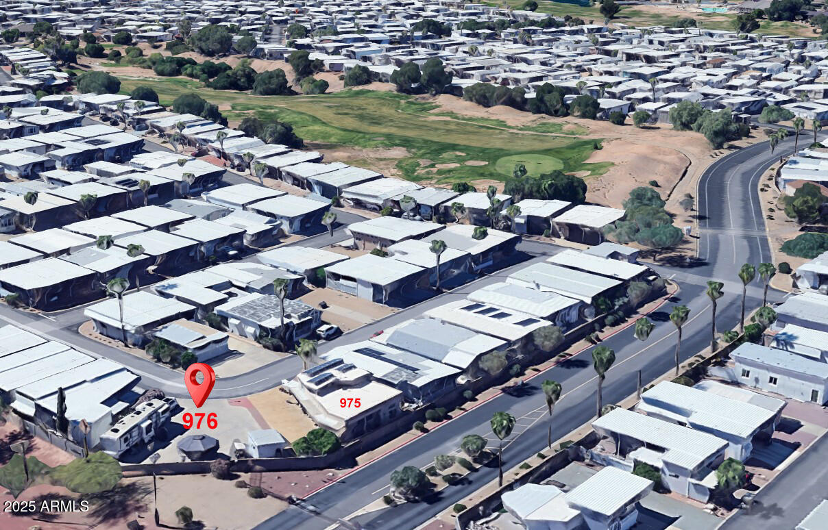 17200 West Bell Road, Unit 976 Surprise, AZ 85374 - Photo 2 of 16 an aerial view of a city with lots of residential buildings