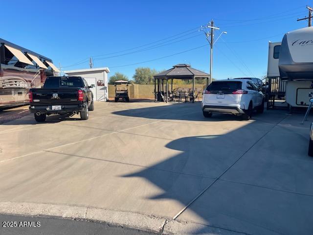 17200 West Bell Road, Unit 976 Surprise, AZ 85374 - Photo 5 of 16 a view of a cars park in front of a house