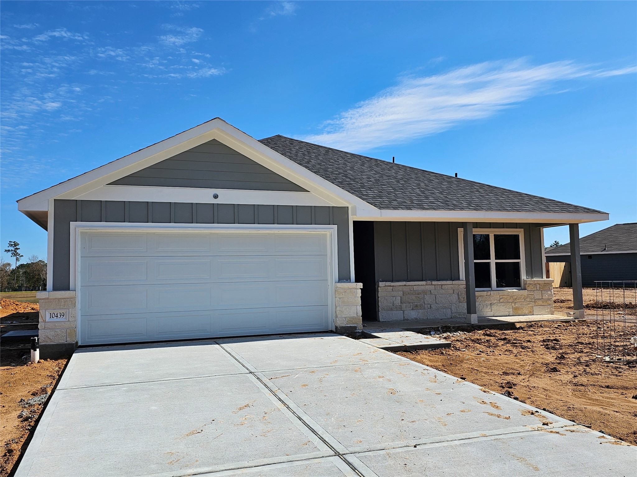 a front view of a house with a garage