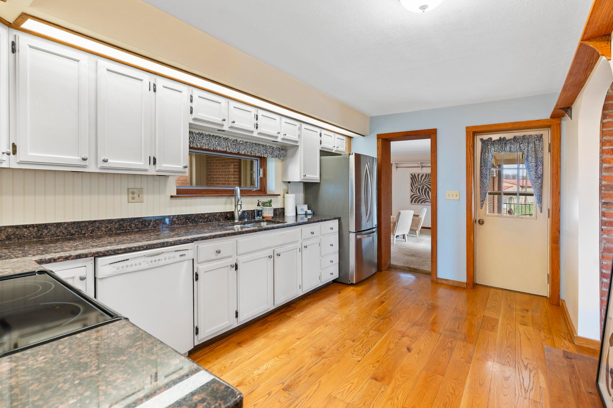 13535 Vans Valley Road Galena, OH 43021 - Photo 12 of 87 Kitchen with view to the back patio