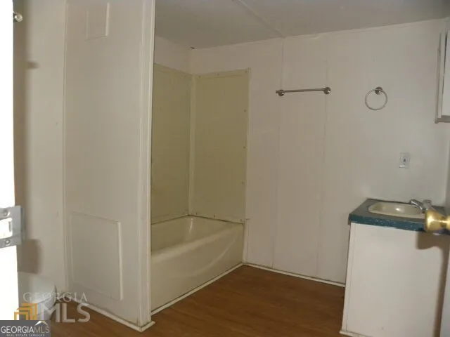 a view of a barn in the middle of a yard