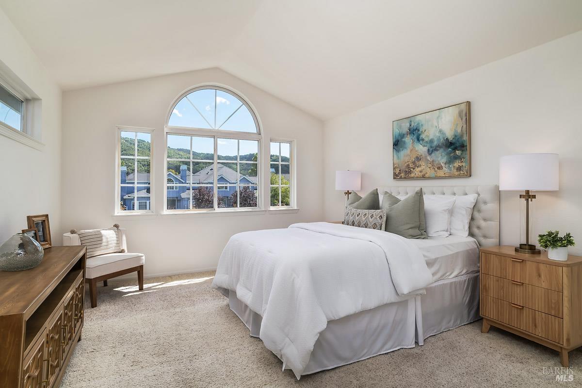 66 Mariners Circle San Rafael, CA 94903 - Photo 15 of 26 Spacious master bedroom has stunning views of the lagoon and surrounding hillside.