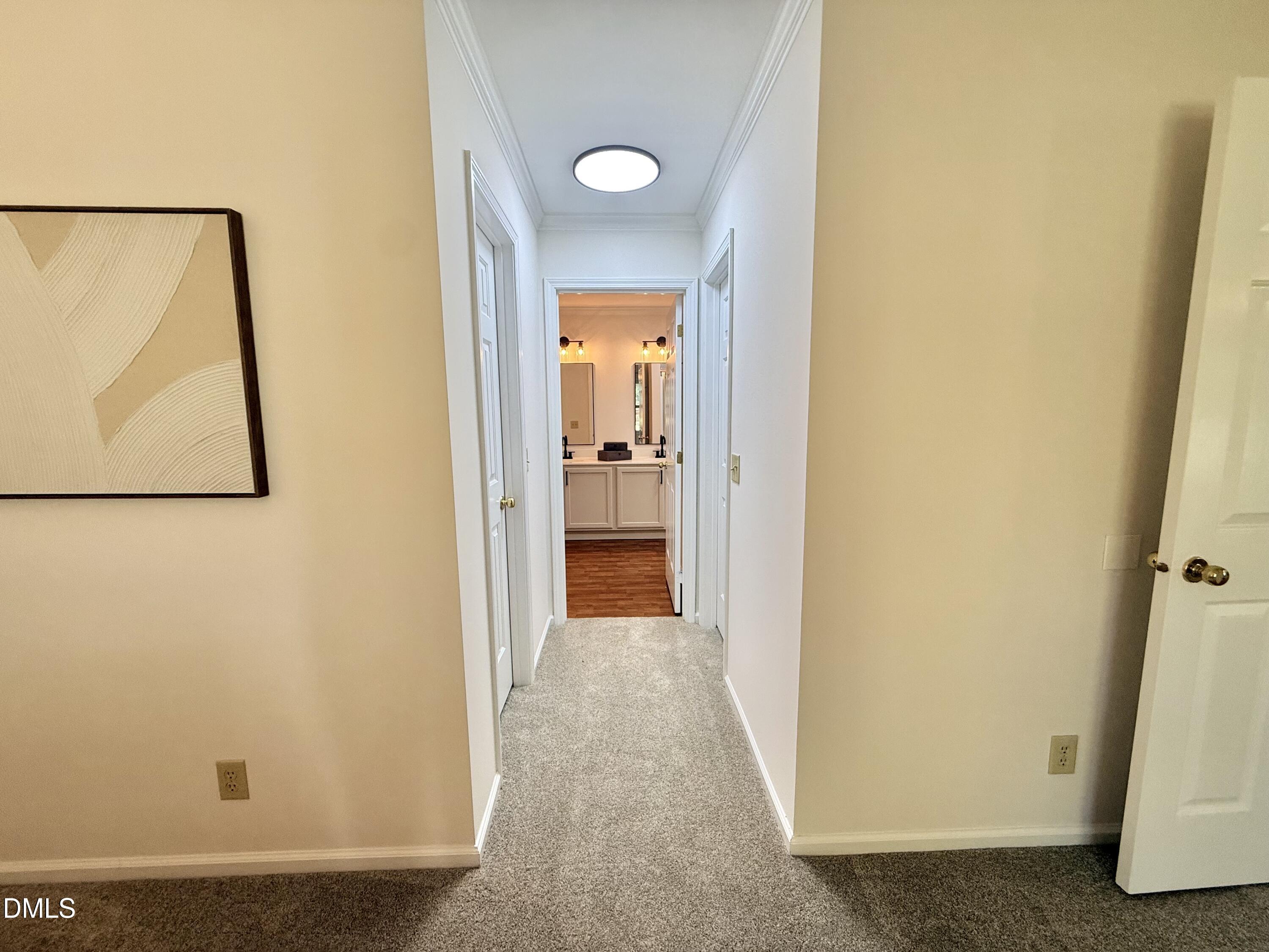 2429 Halifax Road Roxboro, NC 27573 - Photo 29 of 54 a view of a hallway with paintings on the wall