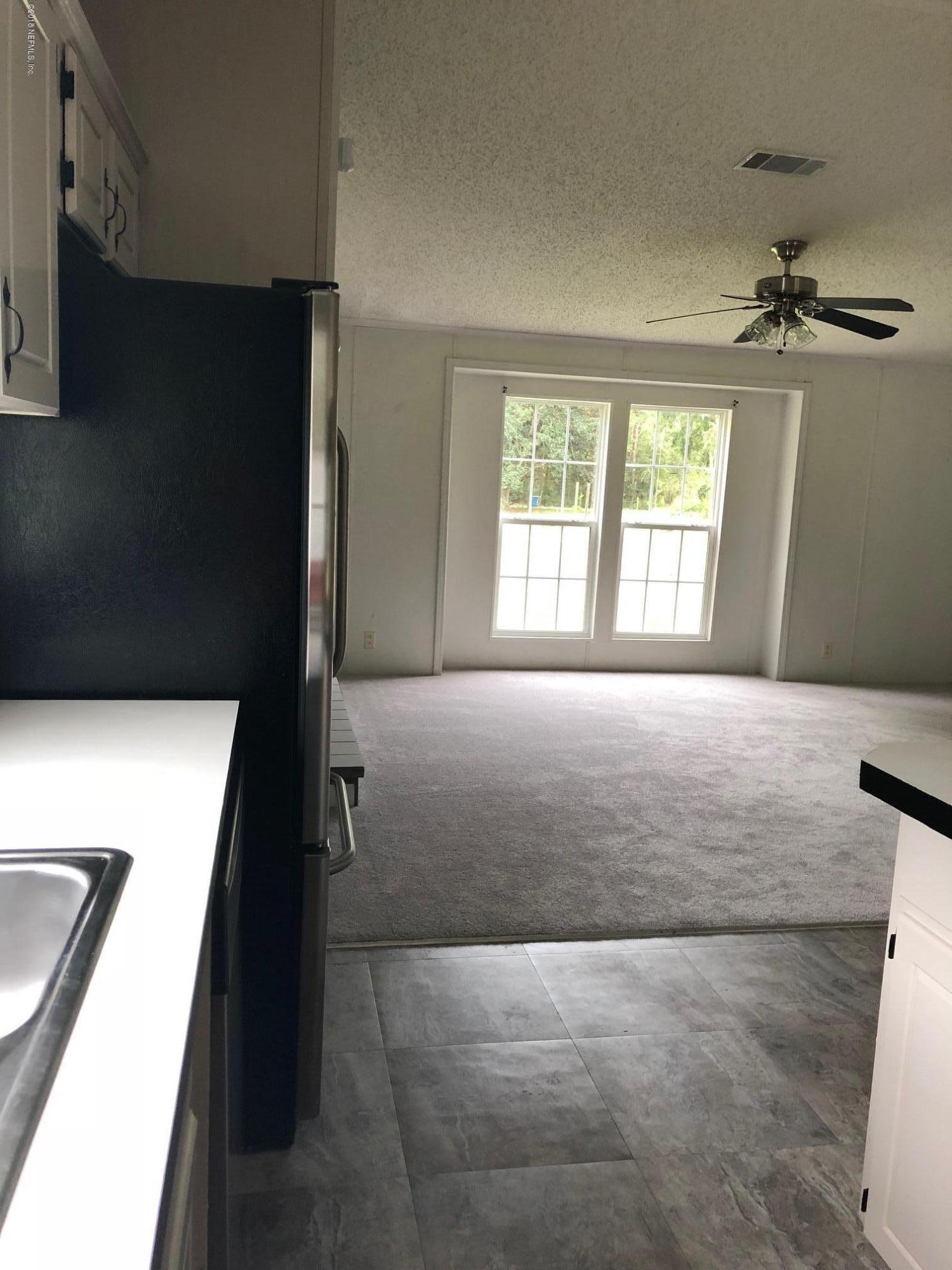 573 Bernard Road Jacksonville, FL 32218 - Photo 15 of 33 DINING VIEW FROM KITCHEN BERNARD