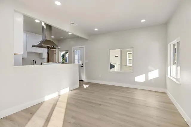 a view of a kitchen with a sink and a window