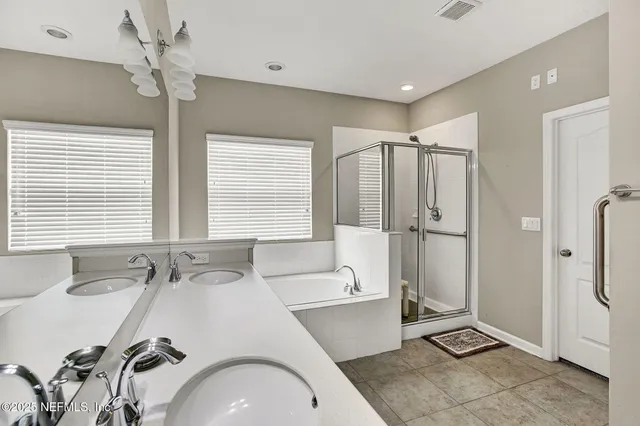 a bathroom with a sink and a large mirror