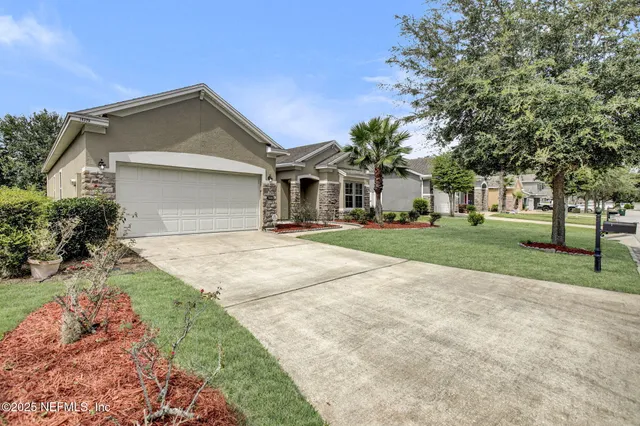 a front view of house with yard and green space
