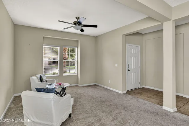 a living room with furniture and windows