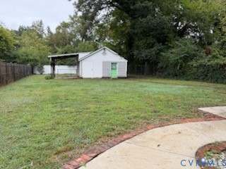 3109 Johnson Road Richmond, VA 23223 - Photo 18 of 21 Fenced backyard with garage with workshop