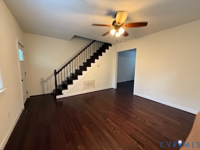 3109 Johnson Road Richmond, VA 23223 - Photo 3 of 21 Living room featuring stairs, dark wood-style floo
