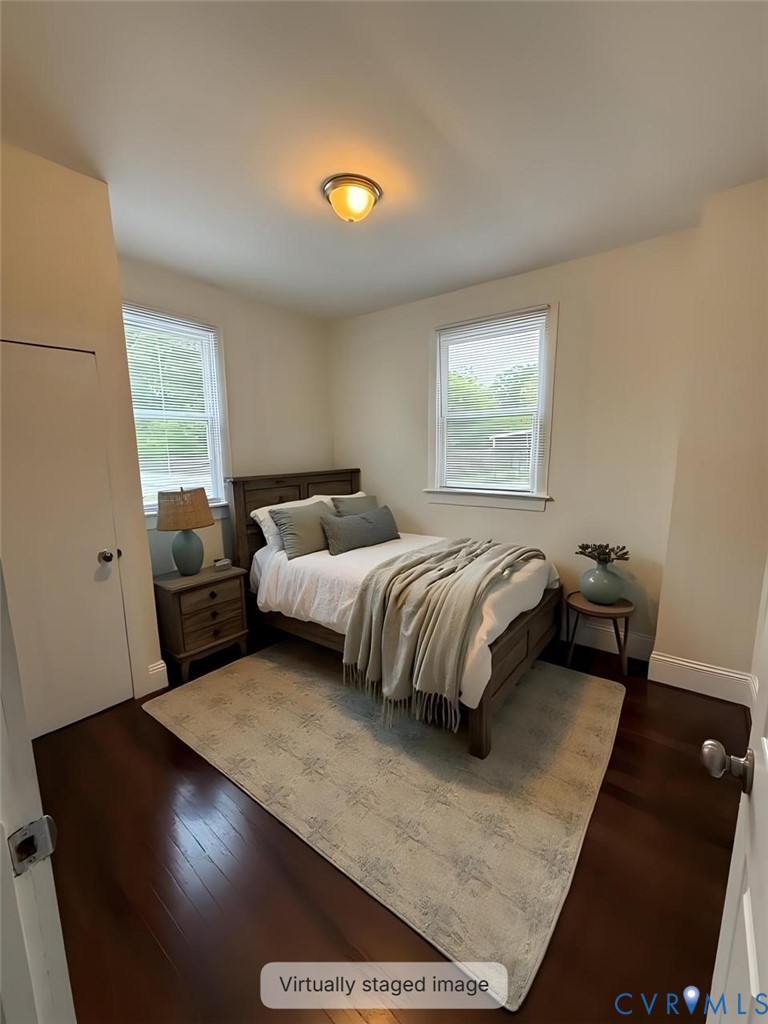 3109 Johnson Road Richmond, VA 23223 - Photo 6 of 21 a bedroom with a bed and wooden floor