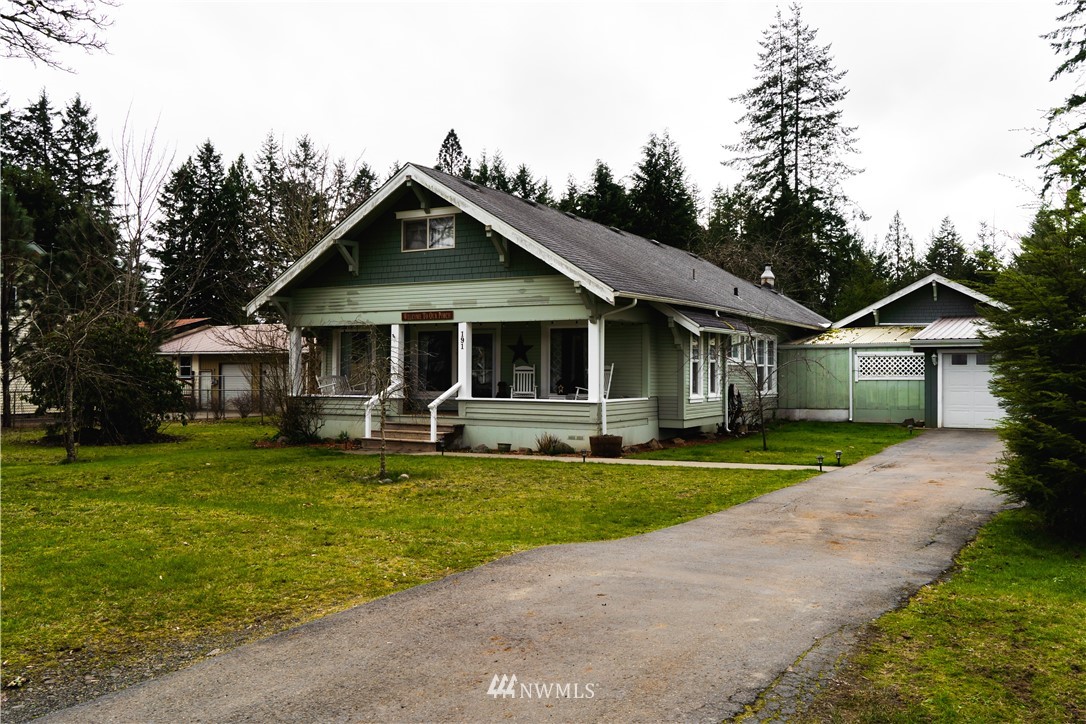 191 Stevens Road Doty, WA 98539 - Photo 2 of 19 a front view of a house with a garden and trees