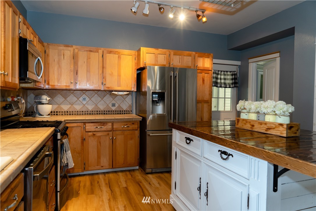 191 Stevens Road Doty, WA 98539 - Photo 11 of 19 a kitchen with stainless steel appliances granite countertop a refrigerator and a sink