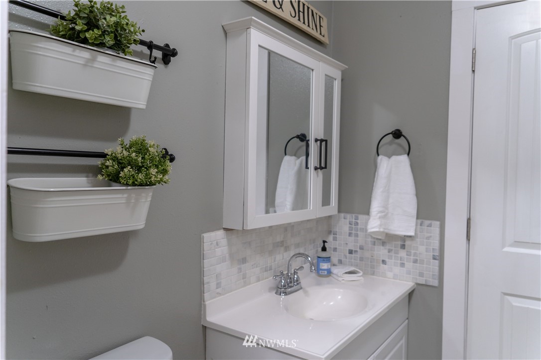 191 Stevens Road Doty, WA 98539 - Photo 13 of 19 a bathroom with a sink and a mirror
