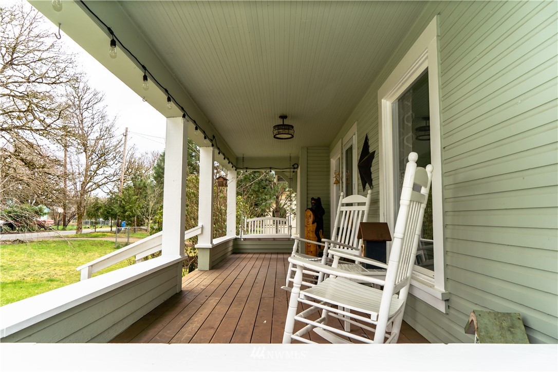 191 Stevens Road Doty, WA 98539 - Photo 4 of 19 a view of a balcony with chair and wooden floor