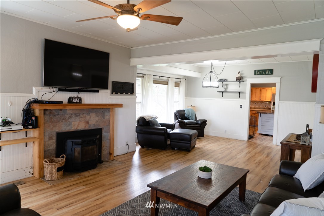 191 Stevens Road Doty, WA 98539 - Photo 5 of 19 a living room with furniture a flat screen tv and a fireplace