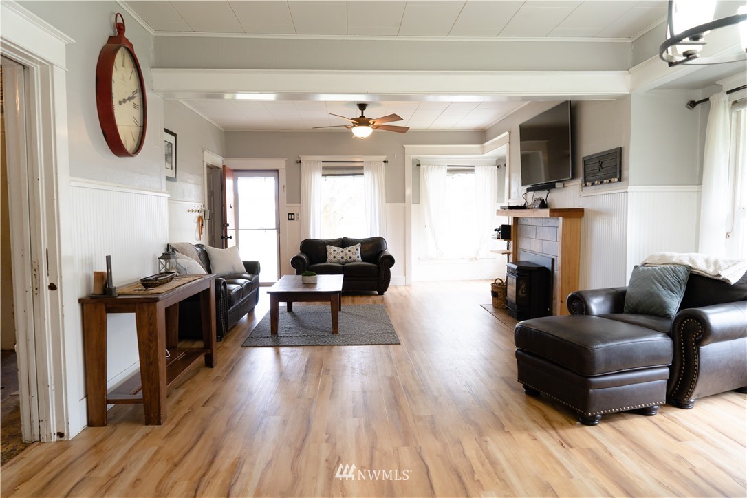 191 Stevens Road Doty, WA 98539 - Photo 7 of 19 a living room with furniture a flat screen tv and a fireplace
