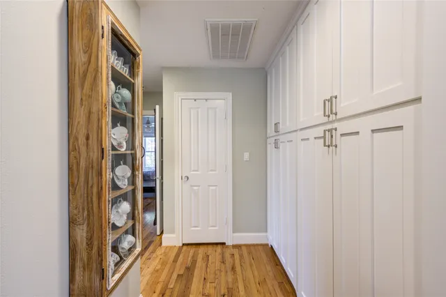 a view of front door with wooden floor