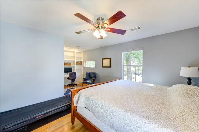 a bed room with a bed and a window