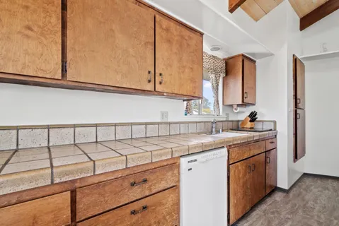 a kitchen with a sink and cabinets