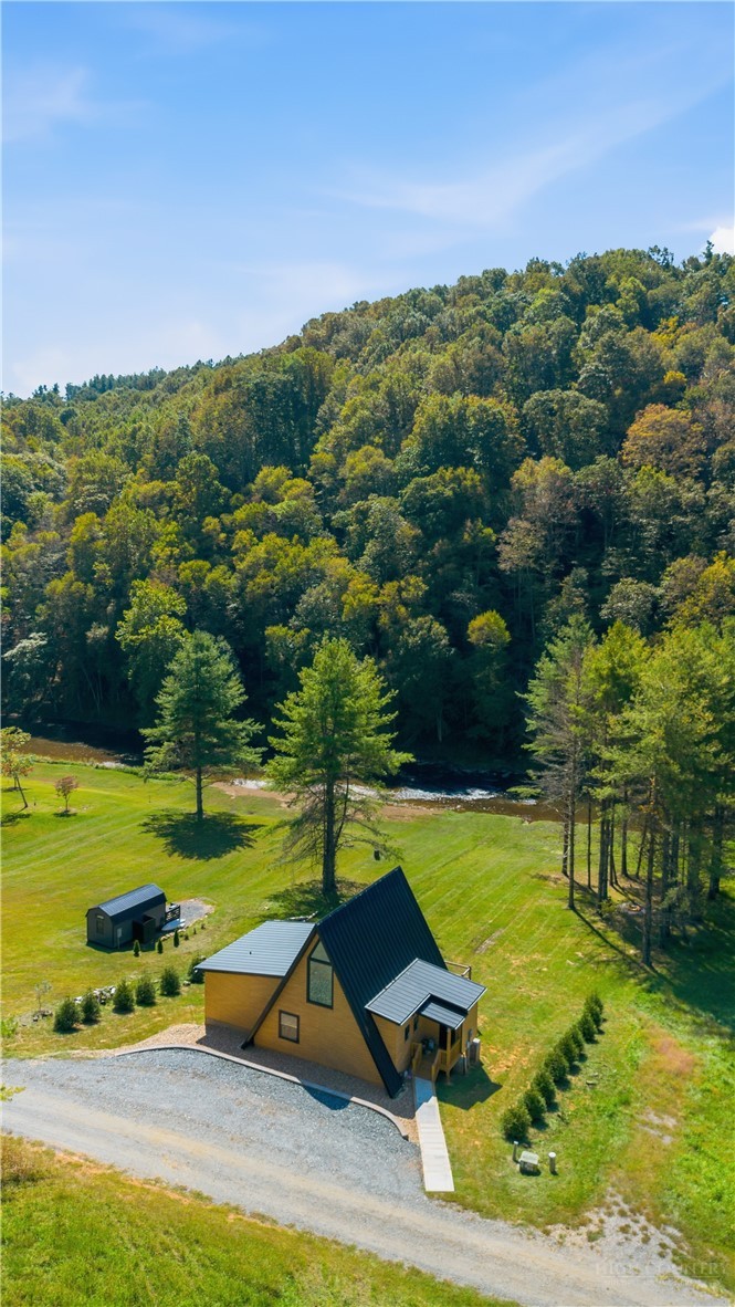 355 South River Hills Road Lansing, NC 28643 - Photo 34 of 45 an aerial view of a residential houses with outdoor space and trees all around
